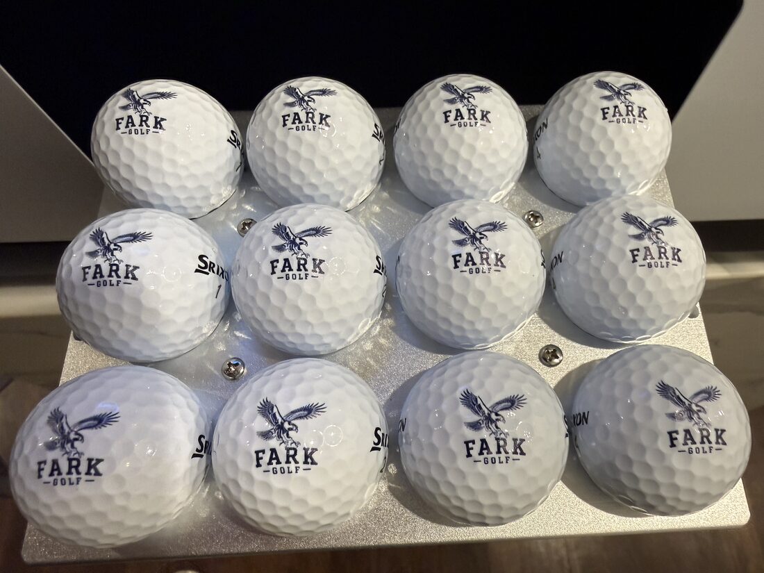 premium golf balls printed with the detailed navy FARK Golf eagle illustration